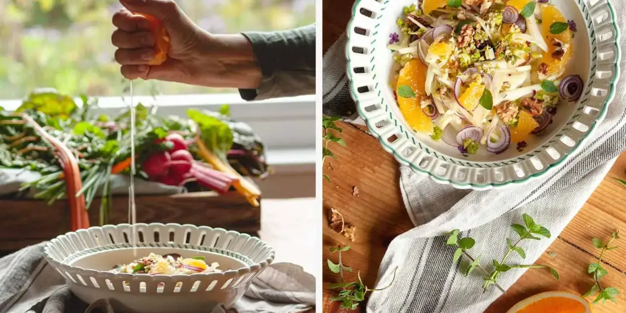 Frische Zutaten für eine insalata siciliana: Fenchel, Orange, rote Zwiebeln und Walnüsse werden in einer Schüssel angerichtet.