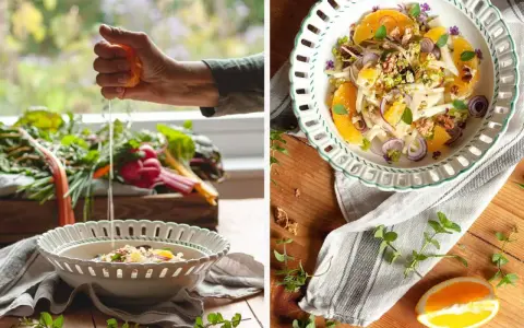 Frische Zutaten für eine insalata siciliana: Fenchel, Orange, rote Zwiebeln und Walnüsse werden in einer Schüssel angerichtet.